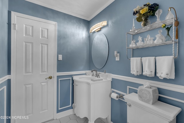 bathroom featuring ornamental molding, toilet, and vanity