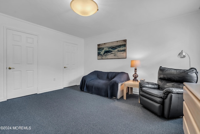 living room featuring ornamental molding and dark carpet