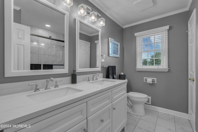 bathroom featuring ornamental molding, vanity, toilet, and a shower with door