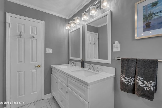 bathroom with crown molding and vanity