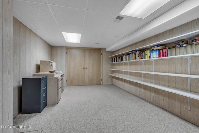 interior space with light colored carpet and a paneled ceiling