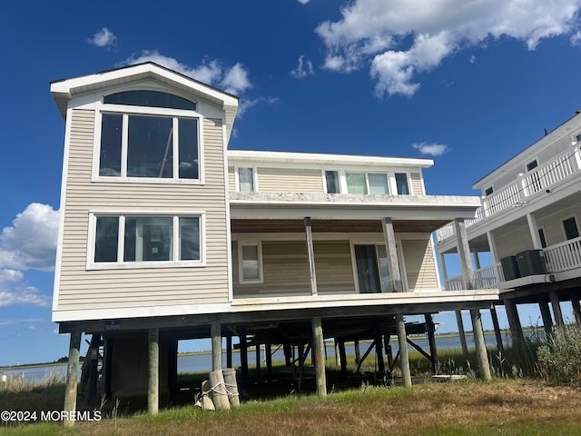 back of house with a balcony