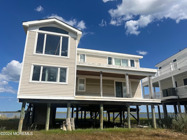 back of property with a balcony