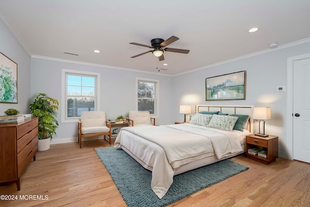 bedroom featuring light hardwood / wood-style flooring, ceiling fan, and ornamental molding