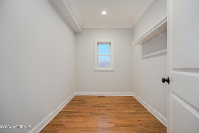 walk in closet featuring light hardwood / wood-style flooring