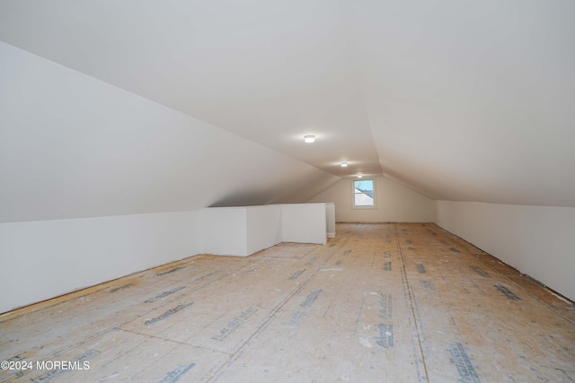 bonus room with vaulted ceiling