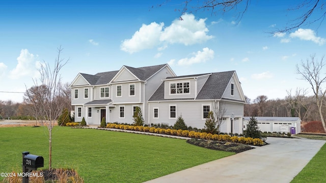 view of front facade featuring a garage and a front lawn