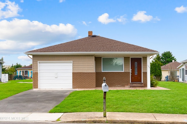 view of front of property with a front lawn and a garage