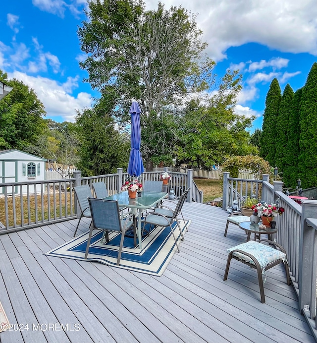 deck with a storage shed