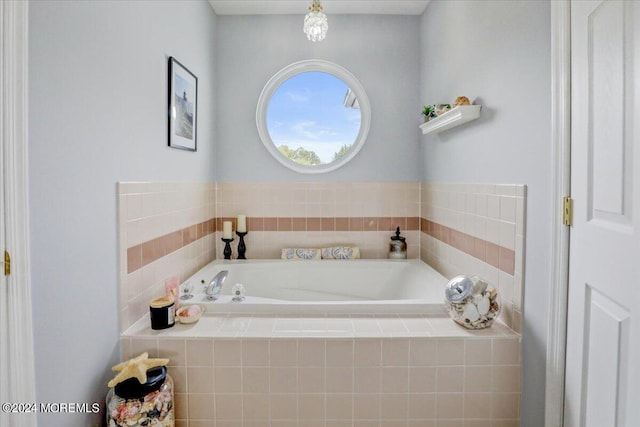 bathroom featuring a relaxing tiled tub