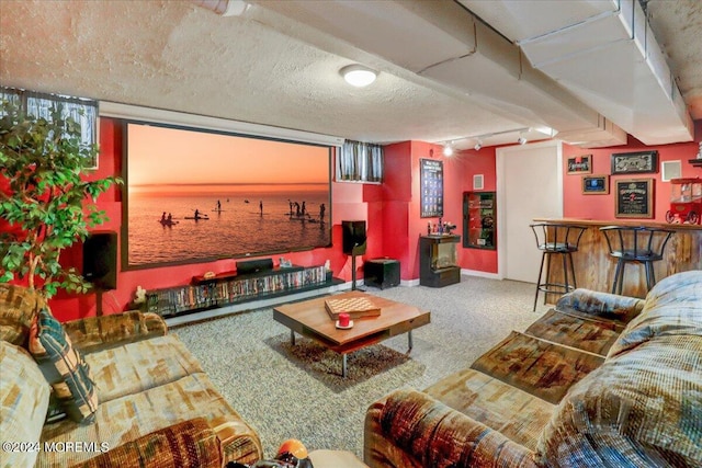 living room featuring rail lighting, a textured ceiling, carpet flooring, and bar