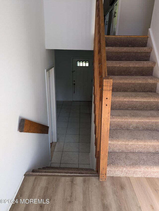 stairway featuring hardwood / wood-style floors