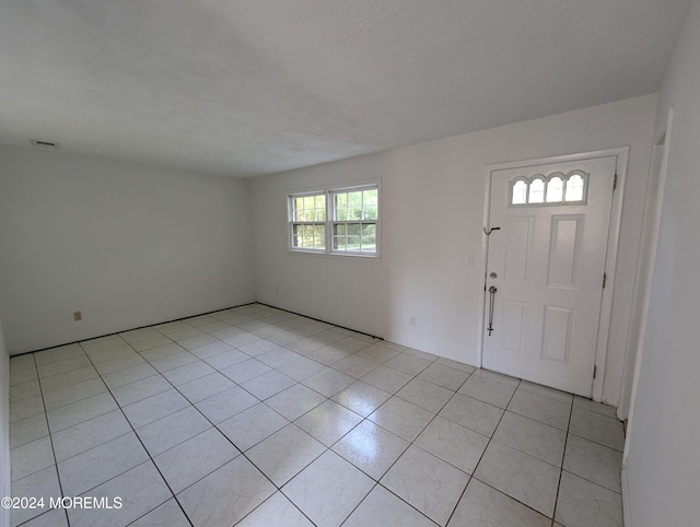 view of tiled foyer entrance