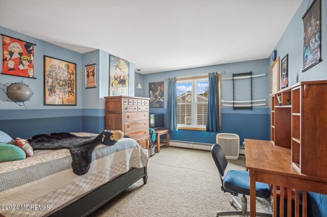 bedroom featuring a baseboard heating unit and carpet flooring