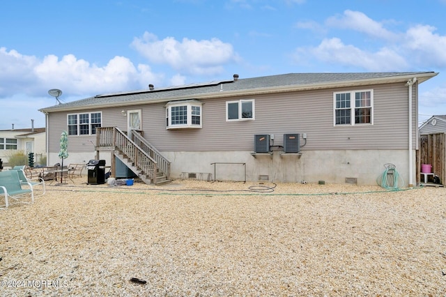 rear view of property featuring a patio and central AC unit