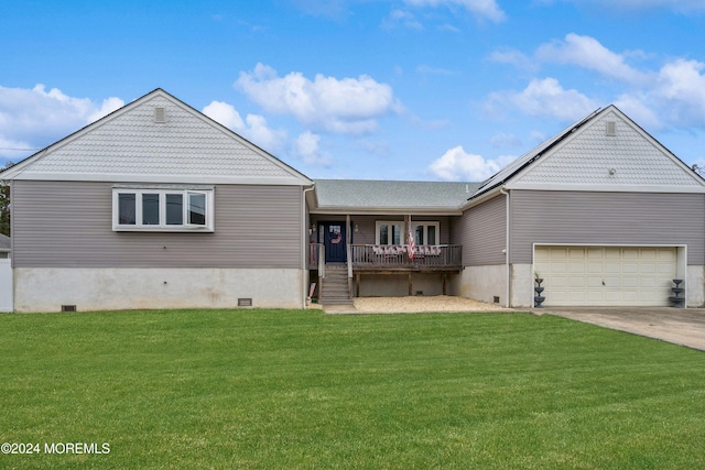 view of front of house with a front yard and a garage