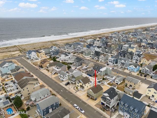 drone / aerial view with a view of the beach and a water view