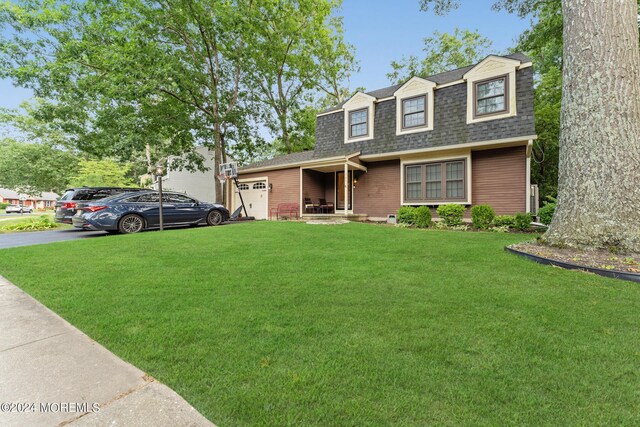 view of front of house with a front lawn and covered porch