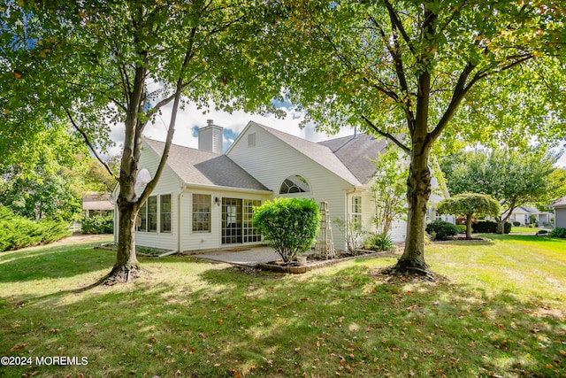 view of home's exterior featuring a lawn