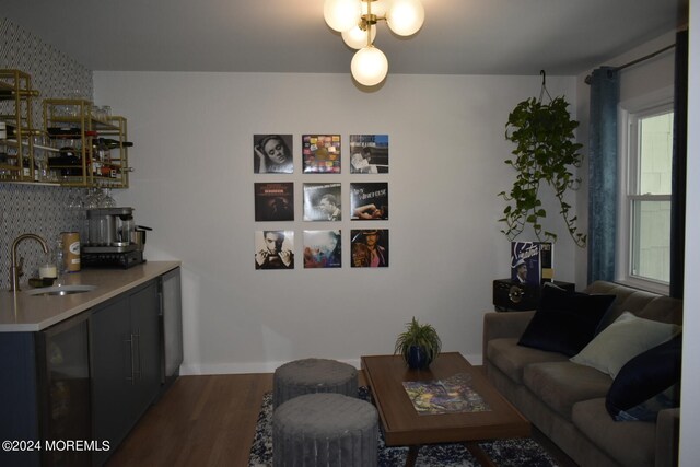 living room featuring indoor wet bar and dark hardwood / wood-style flooring