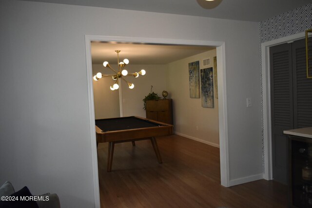 dining area featuring a notable chandelier and dark hardwood / wood-style flooring