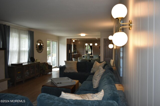 living room with dark hardwood / wood-style flooring