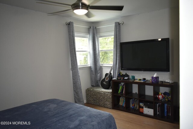 bedroom featuring ceiling fan and hardwood / wood-style floors