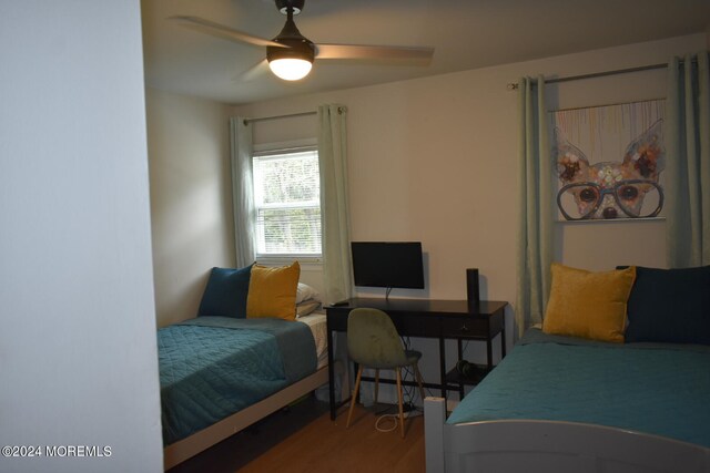 bedroom featuring ceiling fan and hardwood / wood-style flooring