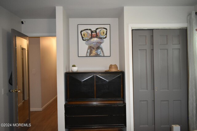 bedroom with hardwood / wood-style flooring