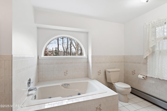 full bathroom featuring tile patterned flooring, toilet, a baseboard heating unit, tile walls, and a tub with jets