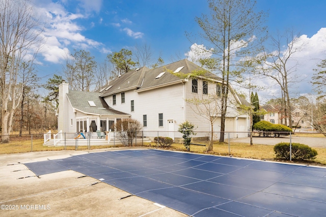 view of swimming pool with a patio area and a fenced backyard