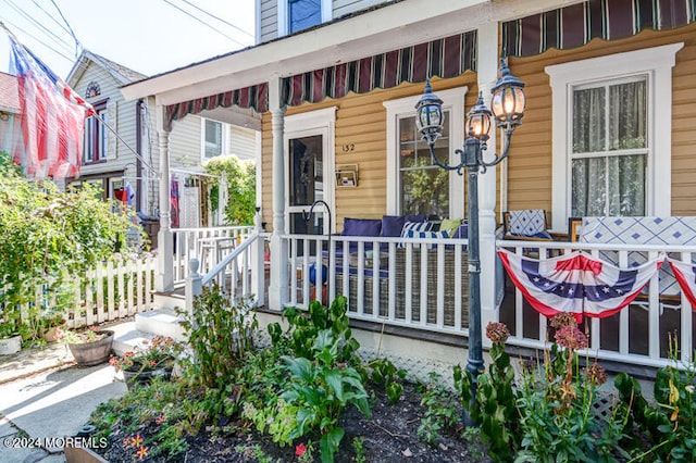 doorway to property featuring a porch