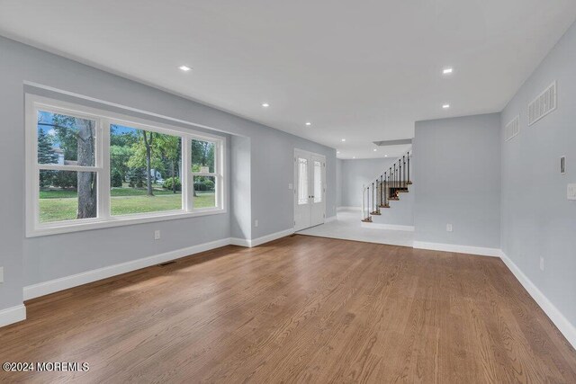 unfurnished living room featuring light hardwood / wood-style floors