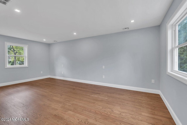 spare room featuring light hardwood / wood-style floors