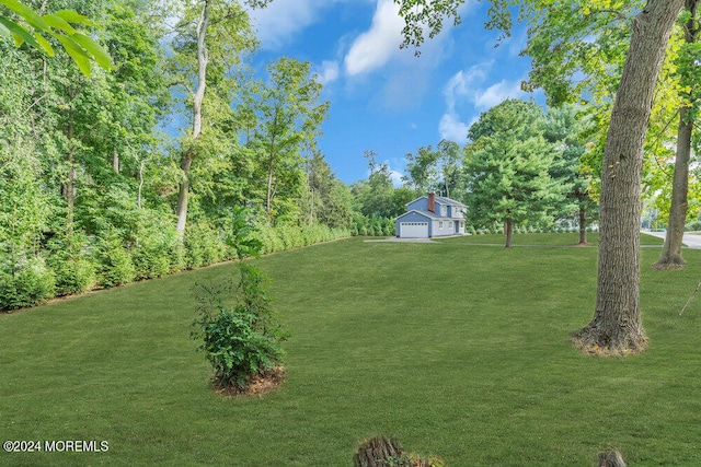 view of yard featuring a garage