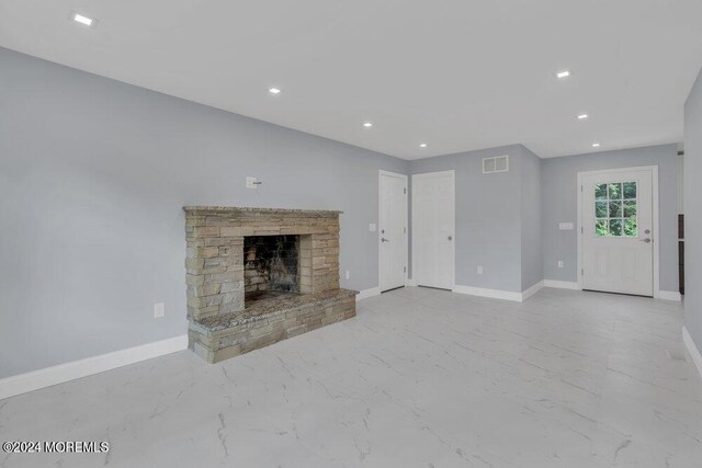 unfurnished living room with a fireplace