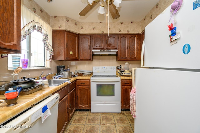 kitchen with ceiling fan, sink, white appliances, and tasteful backsplash