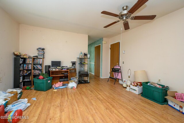 home office with ceiling fan and hardwood / wood-style floors