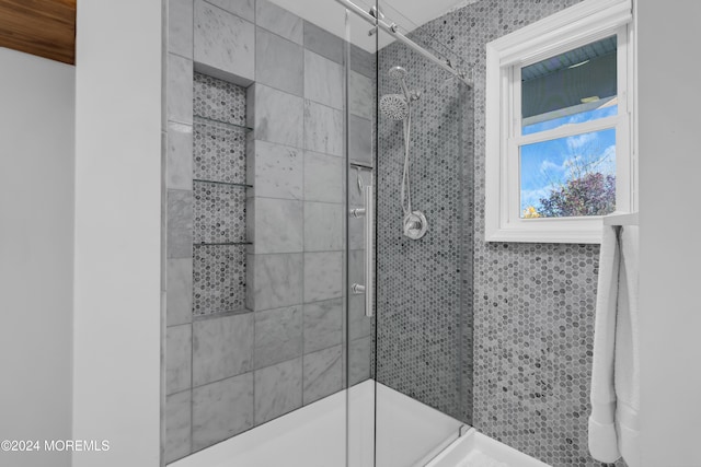 full bath featuring a shower stall