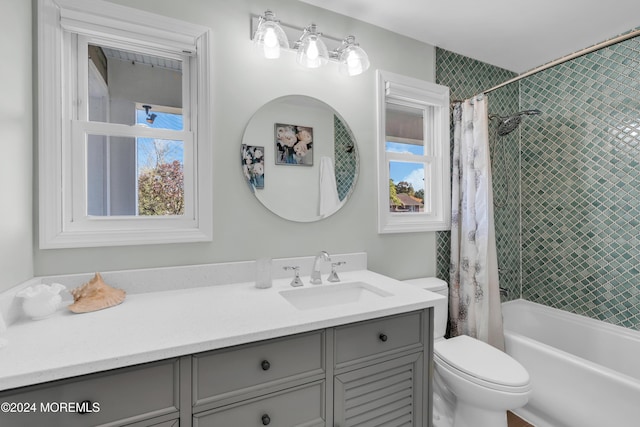 bathroom with vanity, toilet, and shower / tub combo