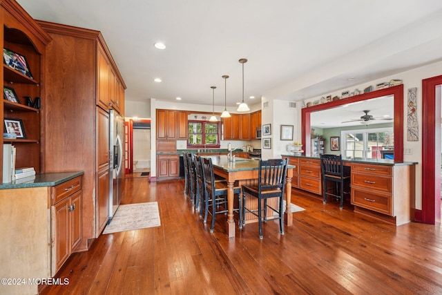 dining area featuring recessed lighting, dark wood-type flooring, and ceiling fan