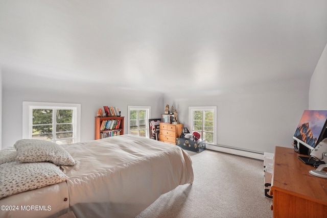 carpeted bedroom with a baseboard radiator and multiple windows