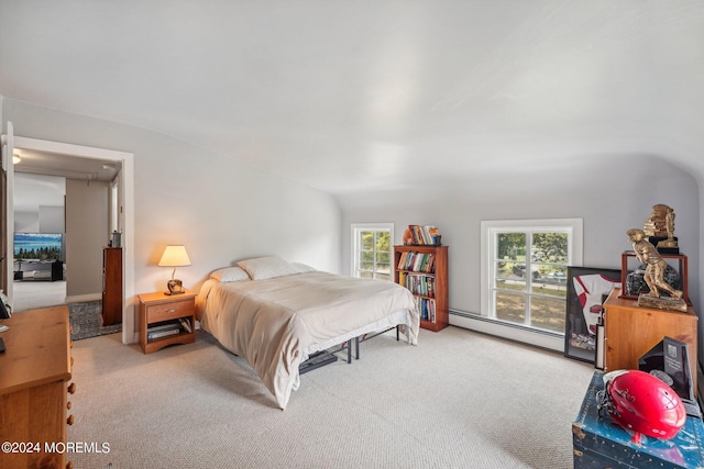 carpeted bedroom featuring baseboard heating