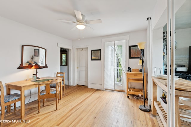 dining area featuring light wood-type flooring and ceiling fan