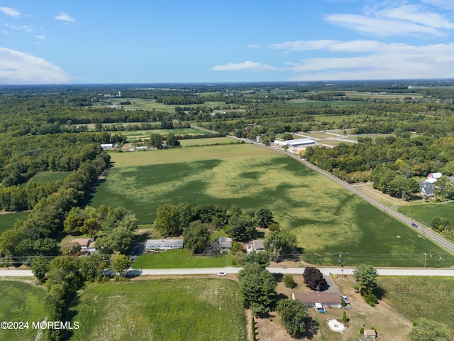 birds eye view of property with a rural view