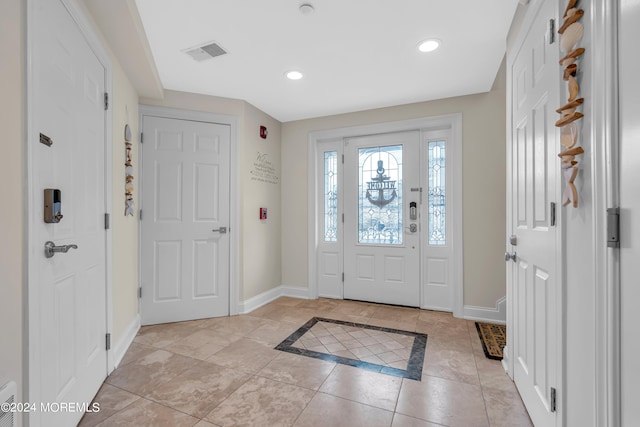 foyer with light tile patterned floors