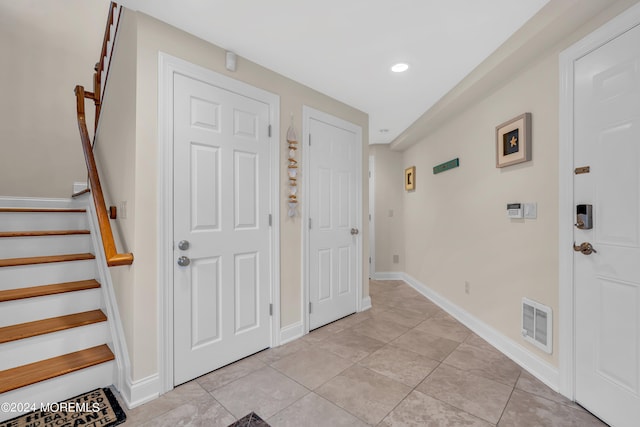 entryway featuring light tile patterned floors