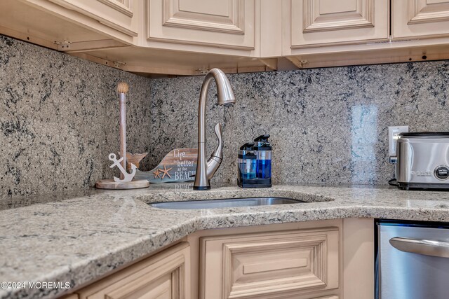 room details featuring dishwasher, backsplash, and sink