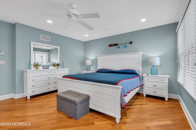 bedroom featuring light wood-type flooring and ceiling fan