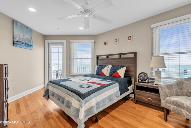 bedroom with wood-type flooring and ceiling fan